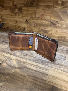 This is a Basic Bifold. Its not too big and not to small. It can be toted in the back pocket or it fits nicely in the front pocket. It has one pocket for bills and 2 good size card pockets. It measures 4 inches x 3.375. The perfect size Minimalist Wallet for those who carry in the front pocket. Leather. Being a natural material, the shade of leather will vary with every wallet made. Brown Trifold Wallet With Pockets, Brown Bifold Card Holder With Pockets, Casual Brown Trifold Wallet With Interior Card Slots, Casual Brown Card Holder With Coin Pocket, Casual Brown Bifold Card Holder, Bifold Wallet With Flat Pocket For Daily Use, Bifold Wallets With Pockets, Classic Bifold Wallets With Pockets, Brown Trifold Wallet With Pockets For Daily Use