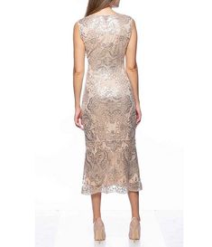 a woman is wearing a dress with sequins on the back and side,