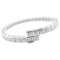 18k White Gold Diamond Tectonique Tennis Bangle Bracelet by Cartier. With 36 Round Brilliant Cut Diamonds VVS1clarity, E color total weight approximately 5.76ct Details: Length: 7" Width: from 11mm to 6mm Weight: 38.6 grams Stamped Hallmarks: Cartier 750 163XXXX(serial number omitted) YOUR PRICE: $30,000 T3191mrndd Luxury Classic Diamond White Bangle, Cartier Bangle, Tennis Whites, White Gold Bangle, Bracelet Tennis, Multi Strand Bracelet, White Gold Bracelet, White Gold Necklaces, Tennis Necklace