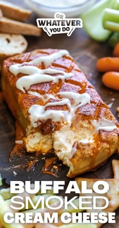 buffalo smoked cream cheese is on the cutting board with carrots and celery