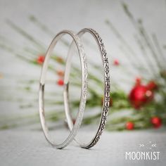 "This beautiful and delicate Sterling Silver bangle bracelet measures 3 mm wide and features a lovely stylized forget me not motif. The inside is gently curved for comfortable wear, and has been antiqued and then polished a second time to show the delicate details of the patterning. This bracelet can be made in any size you need and makes lovely wedding jewelry, commitment jewelry, or memorial jewelry. In the spring, in the lightly shaded woods near my studio, I am always delighted when tiny, ex Bohemian Stackable Wedding Bracelets, Adjustable Bohemian Bangle For Anniversary, Delicate Adjustable Round Bangle, Delicate Stackable Bangle As Gift, Delicate Silver Round Bracelet, Dainty Engraved Bangle Bracelets, Dainty Engraved Bangle Jewelry, Dainty Bangle Bracelet For Her, Bohemian Bracelets With Intricate Design For Anniversary