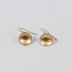 Match these with just about any outfit in your closet. One of our best sellers and one of the new jewelry staples of your wardrobe.  http://www.clpjewelry.com/new/concave-small-earrings  .  .  .  #clpjewelry #handmadejewelry #gold #earrings #goldearrings #jewelry #denverjewelry #303style #dangles #shop303 #shopdenver Yellow Gold Circle Brass Earrings, Yellow Gold Circle Earrings In Brass, Everyday Brass Circle Earrings, Everyday Brass Circular Earrings, Everyday Circular Brass Earrings, Adjustable Hammered Minimalist Earrings, Minimalist Hammered Adjustable Earrings, Hammered Minimalist Adjustable Earrings, Everyday Round Wrap Earrings For Pierced Ears