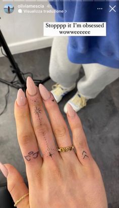 two hands holding each other with tattoos on their fingers and the words, stopppp it's cheese between them