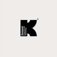 a black and white logo with the letter k in it's center, on a gray background