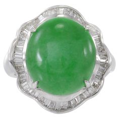 Elevate your style with our 18KT White Gold Jade and Diamond Cocktail Ring. Featuring a genuine green jade center, encircled by 1.50ct-tw baguette-cut diamonds, this ring is a harmonious blend of luxury and sophistication. Make a distinctive statement with this stunning piece that seamlessly combines classic elegance with contemporary glamour. Size 6.75 US. Weight 10.7 gm. Diamond Cocktail Ring, Diamond Cocktail Rings, Baguette Cut Diamond, Baguette Cut, Green Jade, Jade Green, Cocktail Ring, Elevate Your Style, Classic Elegance