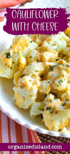 cauliflower with cheese on a white plate next to an orange and pink towel