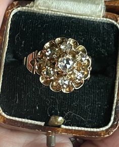 *SUPER COOL*  HANDMADE & UNIQUE Antique Early Victorian 14k Gold Rose Cut Diamond Ring from Amsterdam Estimated circa Approx. 1850 No hallmarks~ but tested 14k  15mm across the top of the ring Size 8 easily resizable within reason ( 2 sizes either way)  7 Prong set Dutch Rose Cut Diamonds all open backed  Impossible to give accurate Carat weight to the diamonds but approx .68ct. total weight Center diamond approx.3.8mm .20ct. The other 6 dutch cut diamonds ranging from approx. 3.5 to 2.9mm avera Victorian Gold Cluster Diamond Ring, Victorian Style Gold Cluster Diamond Ring, Antique Rose Gold Jewelry With Single Cut Diamonds, Victorian Diamond Cut Diamond Ring Gift, Antique 14k Stamped Jewelry For Marriage, Victorian Rose Gold Jewelry With Single Cut Diamonds, Antique Cluster Ring With Diamond Accents For Gift, Rose Gold Cluster Jewelry With Rose Cut Diamonds, Victorian Yellow Gold Cluster Ring Gift