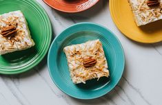 three plates with desserts on them sitting on a counter top next to each other