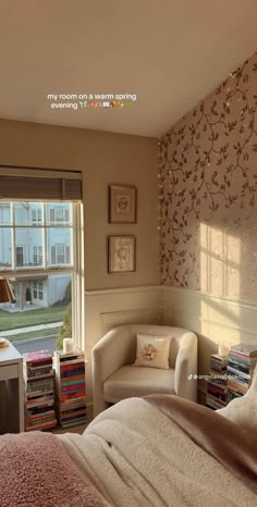 a bedroom with a bed, chair and window