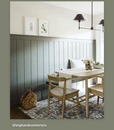 a dining room table with four chairs around it