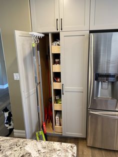 a stainless steel refrigerator and freezer combo in a kitchen