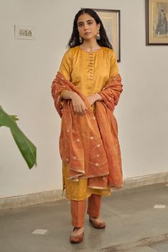 Warm yellow plain kurta. Paired with a pant. Comes along with a rust dupatta with hand embroidery and kiran lace border. - Aza Fashions Slub Silk Kurta With Dupatta For Puja, Diwali Tussar Silk Palazzo Set With Straight Kurta, Raw Silk Set With Dupatta For Puja, Sheer Dupatta Set For Puja And Eid, Sheer Dupatta Sets For Puja On Eid, Sheer Dupatta Sets For Puja During Eid, Sheer Dupatta Set For Eid Puja, Festive Pant Set With Sheer Dupatta For Festivals, Eid Puja Set With Sheer Dupatta