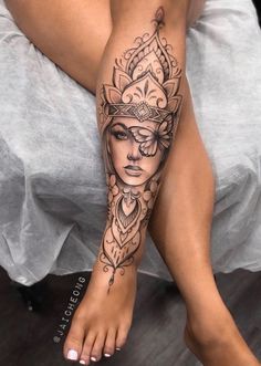 a woman's leg with a tattoo on it