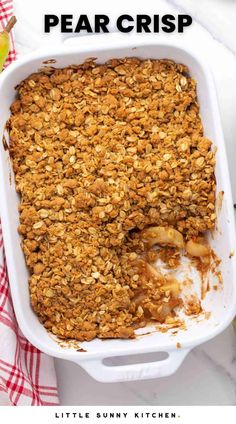 a casserole dish with granola in it and text overlay that reads, pear crisp