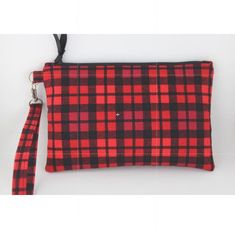 Christmas Red Tartan Plaid Fabric Wristlet Zipper Pouch   Red Tartan Plaid cotton fabric wristlet pouch clutch wallet with padded interfacing for a sturdy feel. Fully lined with random coordinated fabric Interior pocket to hold credit cards, gift cards, and ID.  Zip top closure with ribbon pull tab and coordinated fabric zipper tabs at each end for a clean look.   Detachable silver tone swivel lobster clasp strap. Perfect grab and go purse. Approximate Measurements Bag - 8"L x 5" W Opening: 6 3/4"L Wallet Gift Card, Vintage Hand Tools, Wristlet Pouch, Leather Billfold, Fabric Wallet, Holiday Plaid, Brown Leather Wallet, Holiday Fabric, Wallet Pattern