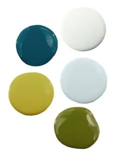 four different colors of paint are shown in this image, including white, blue, yellow and green