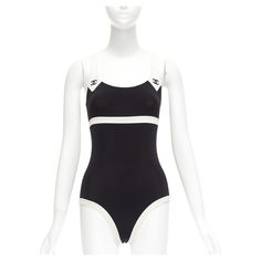 rare CHANEL 96C Vintage CC black cream colorblock swim bodysuit FR36 S Reference: TGAS/D00908 Brand: Chanel Designer: Karl Lagerfeld Collection: 96C Material: Nylon, Blend Color: Black, Cream Pattern: Solid Closure: Slip On Made in: France CONDITION: Condition: Excellent, this item was pre-owned and is in excellent condition. Comes with: Style code present (Generic) SIZING Designer size: FR36 Size reference: US2-4 / UK8 / IT40 / FR36 / XS-S MEASUREMENTS: Top shoulder to shoulder: 24cm / 9.4" Top Chanel Swimwear, Swim Bodysuit, Slim Aarons, Chanel Designer, Yohji Yamamoto, Black Cream, Tiffany & Co., Karl Lagerfeld, Color Blocking