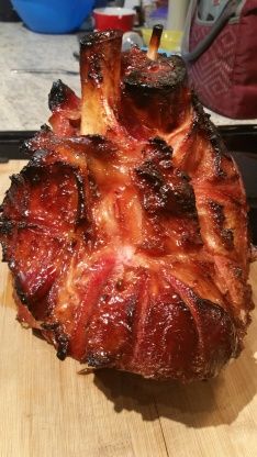 a large piece of meat sitting on top of a wooden cutting board