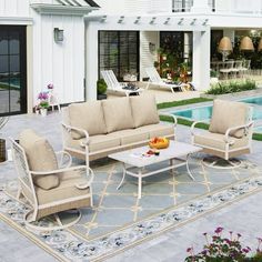 the patio furniture is set up by the pool