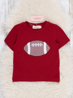 Score a touchdown with this adorable sibling set! This shirt features an embroidered football design & deep crimson hue. Get ready for fall in style with this cute and playful outfit. Fits true to size. 97% Cotton / 3% Spandex Import. *Afterpay and Sezzle Purchase Requires $35 Minimum Order. Game Day Tops With Letter Embroidery, Game Day Tops With Embroidered Graphics For Sports Season, Varsity T-shirt With Embroidered Graphics For Game Day, Red College T-shirt For Football Season, Embroidered Football Shirts, Patchwork Clothes, Football Design, Football Shirts, Football