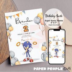 an image of a birthday party with sonic the hedgehog on it and a phone next to it