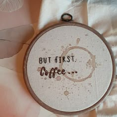 a cross stitch pattern with the words but first coffee on it