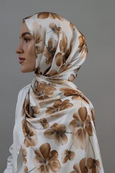 Indulge in elegance with our Satin Silk Hijab Collection, meticulously crafted to delicately hug your face with the most feminine touch you can ever imagine. The high-shine fabric, creates a luxurious and drippy texture, ensuring you look and feel special on every occasion. This limited-edition collection offers a unique blend of exclusivity and sophistication, with a shimmer that stands out in any crowd. With 5 classy prints, our Satin Silk hijabs are versatile for dressing up formal events or Luxury Satin Scarves With Satin Finish, Printed Hijab Scarfs, Classy Prints, Printed Hijab, Hijab Magnets, Satin Hijab, Silk Hijab, Modest Dresses For Women, Hijab Collection