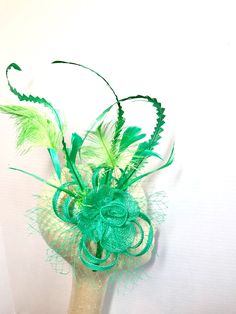 "Sinamay Fascinator with feathers attaches with hair comb. Style: The Ellie Rose ♥Attaches with hair comb which allows you to place the piece as you like. ♥Ultra Light & comfortable to wear. ♥Packed and shipped in a sturdy box with special love & care to ensure a safe delivery. ♥Includes a hat care card with instructions on how to care for & keep your piece beautiful. ♥Over 14,000 pieces sold & 2,000 5 star reviews. Our \"Hive Girls\" come back year after year for their next hat Green Headband Fascinator For Party, Green Headband For Royal Ascot Party, Green Spring Party Hair Accessories, Green Headband For Kentucky Derby Party, Green Headband For Party, Spring Party Green Headband, Green Spring Party Headband, Green Feathered Mini Hat For Wedding, Green Headband Mini Hat For Kentucky Derby