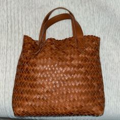 Used Once. In Very Good Condition. Brown Woven Madewell Shoulder Bag. Comes With Shoulder Strap. Woven Leather Shopping Pouch, Shopping Pouch Bag In Woven Leather, Intrecciato Weave Pouch Bag, Brown Intrecciato Weave Satchel For Shopping, Cognac Woven Leather Bag For Everyday Use, Everyday Cognac Woven Leather Bag, Everyday Bucket Bag With Intrecciato Weave, Daily Use Cognac Woven Leather Bag, Intrecciato Weave Bucket Bag For Everyday Use