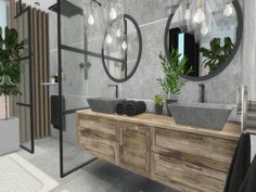 a bathroom with two sinks, mirrors and plants in the middle of the sink area