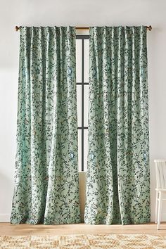 the curtains in this room are green and blue