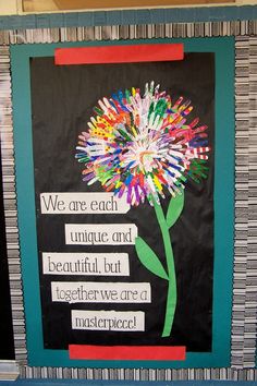 a bulletin board with a flower on it