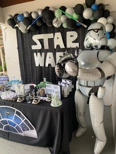 a star wars themed party with balloons and decorations, including a stormtrooper balloon