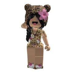 a girl in a leopard print dress and pink flower on her head is standing next to a cardboard box