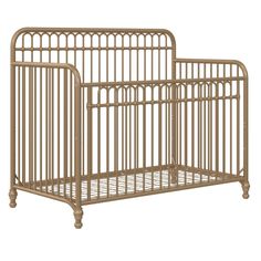 a baby crib that is made out of metal