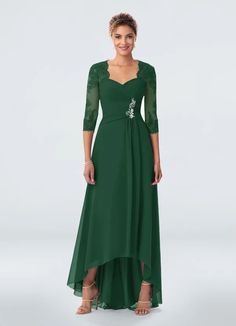 a woman in a long green dress