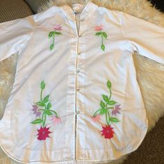 Such a gorgeous piece!  White, button down, bell flared sleeves, hand embroidered flowers on front,back and sleeves.  Made in the Philippines.  Asian, boho, hippie Cotton Button-up Blouse With Floral Embroidery, Bohemian Beach Shirt For Spring, Bohemian Shirt For Spring Beach Occasion, Spring Bohemian Long Sleeve Shirt, Bohemian Long Sleeve Spring Shirt, Bohemian Long Sleeve Shirt For Spring, Spring Cotton Bell Sleeve Blouse, Summer Tops With Multicolor Embroidery And Buttons, Spring Bell Sleeve Cotton Blouse