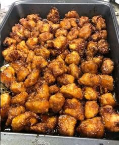 a pan filled with fried food sitting on top of a table