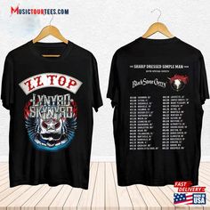 two t - shirts with the band's concert dates on them, one is black and