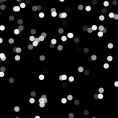 black and white boket background with lots of small dots in the dark sky