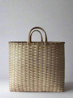 a large woven basket with handles