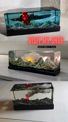 two aquariums with lights on each side and the words visit my shop above them