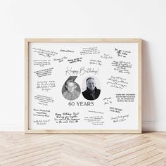 a wooden frame with two people's names and handwritten notes on it, in front of a white wall