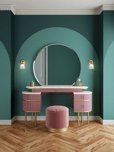 a pink vanity and stool in front of a green wall with a round mirror on it