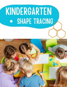 children are sitting at a table and playing with shapes in the shape of hexagons