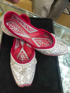 Step into the world of timeless Punjabi craftsmanship with our exquisite Punjabi Silver Jutti, a perfect blend of tradition and style. These stunning juttis are meticulously handcrafted to add a touch of ethnic elegance to your attire, whether you're dressing up for a special occasion or simply want to elevate your everyday look. * Features * 1.)  Intricate Silver Embroidery: Each jutti is adorned with intricate silver thread embroidery that showcases the rich heritage of Punjab. The dazzling pa Silver Jutti, Bridal Footwear, Punjabi Culture, Silver Embroidery, Punjabi Wedding, Thread Embroidery, Ethnic Wear, Memorable Gifts, Bridal Shoes