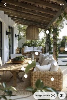 an outdoor living room with wicker furniture