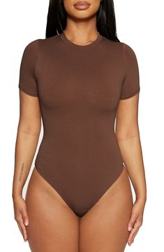 Sleek all-in-one style and breathable stretch jersey makes this T-shirt bodysuit a svelte option for all your plans. This form-fitting essential is made from the label's signature NW fabric, which is double lined, has four-way stretch, comfortable compression and a subtle crepe texture. Snap closure Crewneck Short sleeves Thong back Lined 95% viscose, 5% spandex Hand wash, line dry Imported | Naked Wardrobe The NW Lovin' the Crew T-Shirt Bodysuit Basic Solid Color Elastane Bodysuit, Trendy Fitted Short Sleeve Bodysuit With Crew Neck, Trendy Fitted Short Sleeve Crew Neck Bodysuit, Trendy Fitted Crew Neck Short Sleeve Bodysuit, Casual Fitted Seamless Bodysuit, Fitted Solid Color Bodysuit With Crew Neck, Fitted Solid Color Crew Neck Bodysuit, Trendy Short Sleeve Bodysuit For Loungewear, Casual Bodysuit With Minimal Stretch