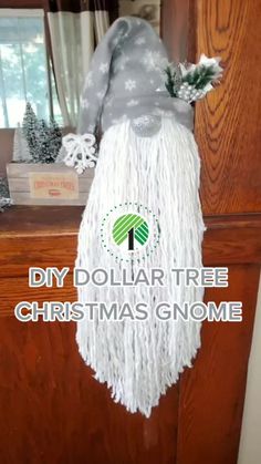 a christmas decoration made out of yarn with the words diy dollar tree christmas gnome