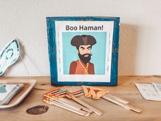 a wooden table topped with lots of items and a sign that says boo hamm